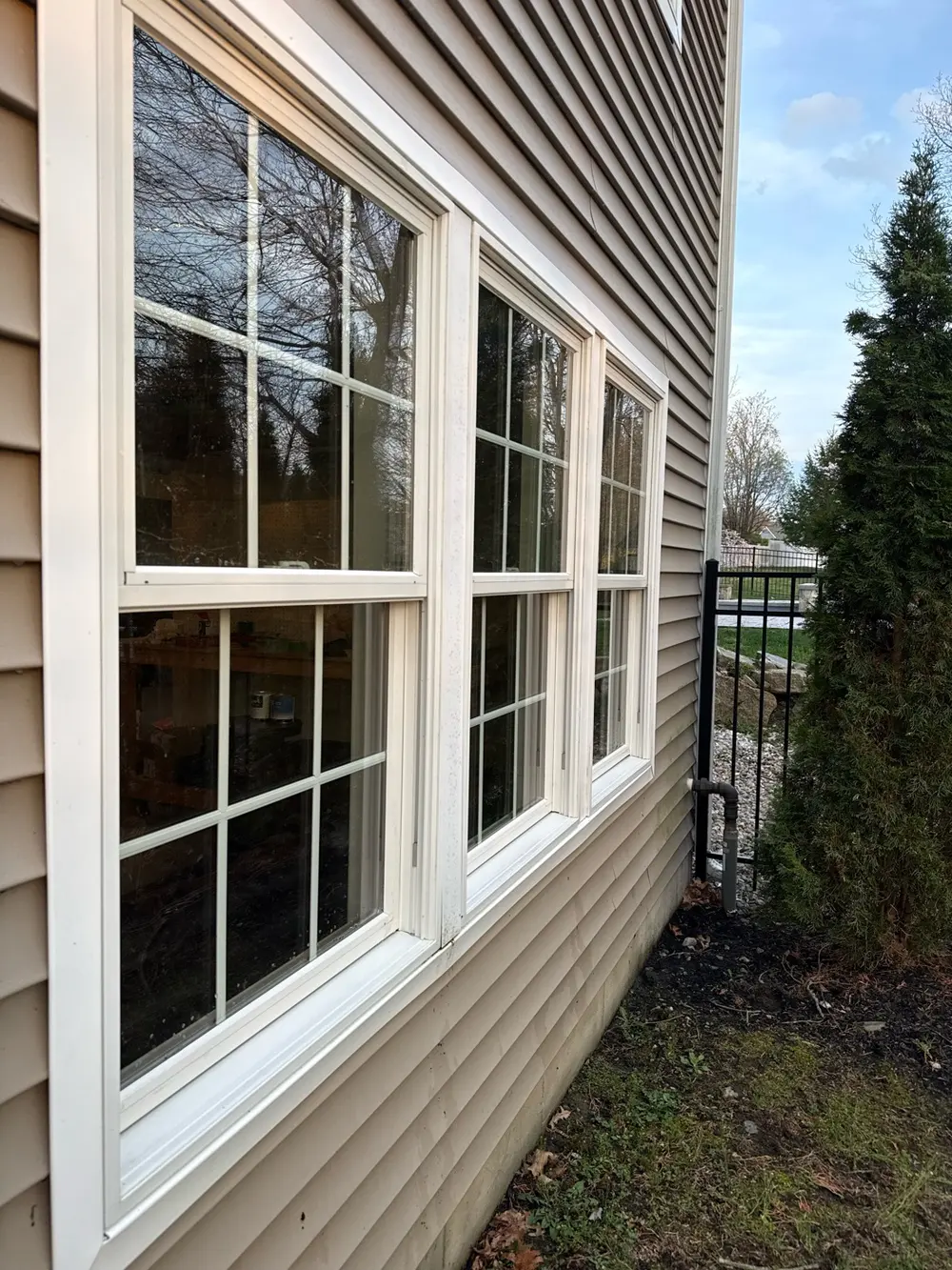 After: the same windows with clear glass and clean white sills